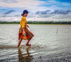 Girl walking in water  - © K. Simon